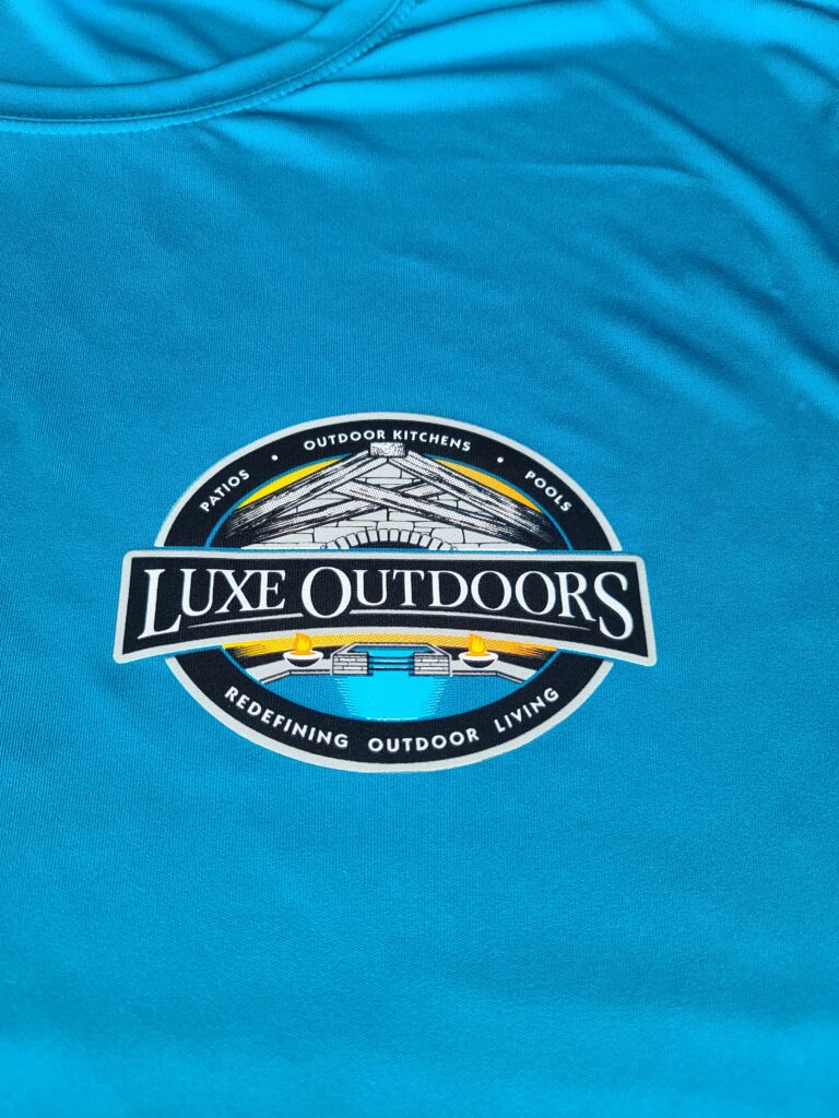 Turquoise screen-printed Luxe Outdoors shirt produced by Ugly Guppy in Houston